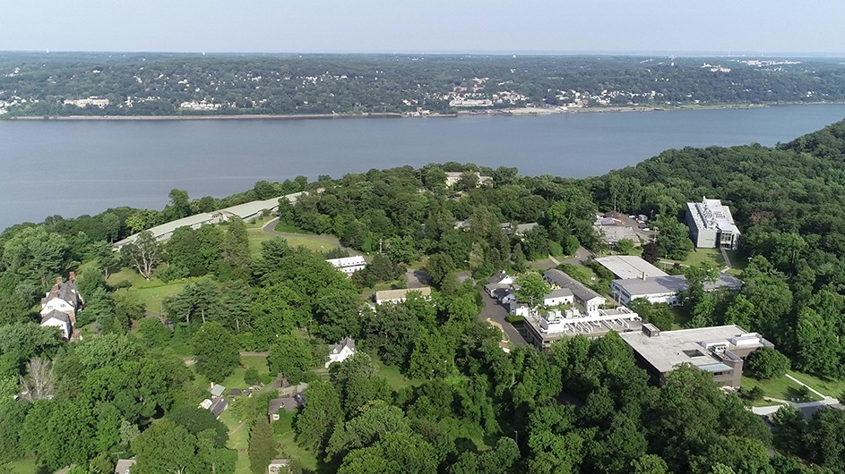 Columbia University's Lamont-Doherty Earth Observatory campus among trees and alongside the Hudson River in Palisades, New York.