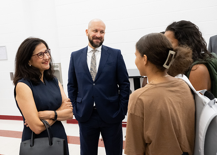 Columbia President Minouche Shafik and Columbia College Dean Josef Sorett speak with Double Discovery students after the lecture. 