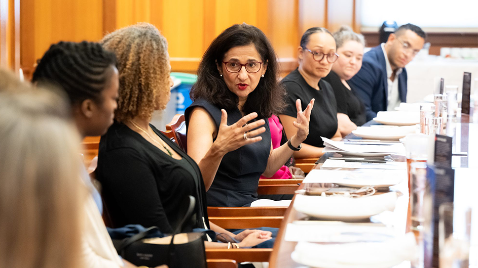 President Shafik speaks with a roundtable of experts at a Double Discovery Event.