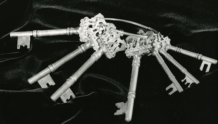Ceremonial keys, undated. Photo courtesy Columbia University Archives. A black and white photograph of ornate keys on a velvet pillow