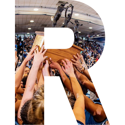 A block letter R with the Columbia women's basketball team holding a championship trophy.