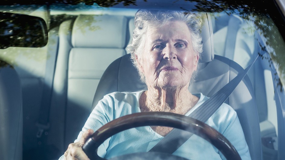 An older person driving.