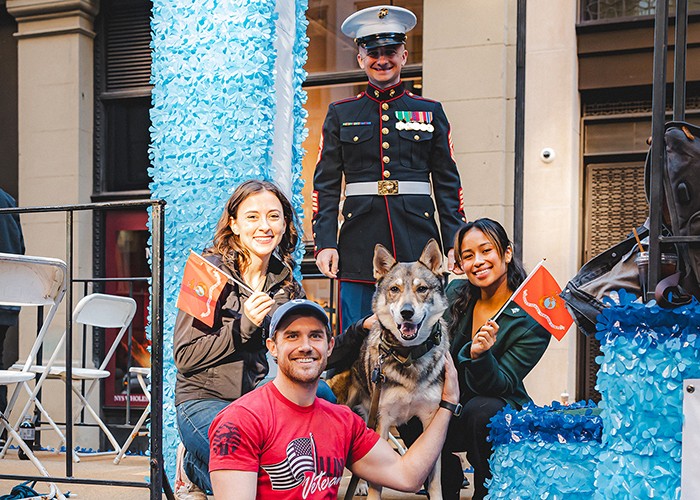 Even Columbia’s pets take part in the Veterans Day Parade, answering a call to service only they can hear, but which is no less meaningful to us. Photo by Brandon Vallejo. Student Veterans on the university's Veterans Day float with their canine companion, a German Shepherd