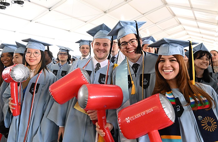 Columbia Engineering students hold their inflatable hammers with pride during their Class Day ceremony on Sunday, May 12, at Baker Athletics Complex. Photo by Eileen Barroso. School of Engineering and Applied Sciences students hold their hammers.