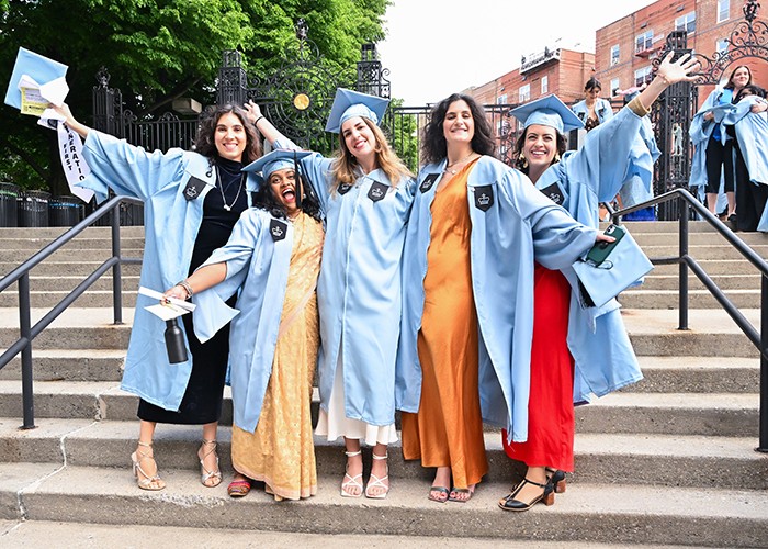 Graduates from the School of International and Public Affairs celebrate ahead of their Monday, May 13, school graduation ceremony at Baker Athletics Complex. Photo by Diane Bondareff. Graduates from the School of International and Public Affairs celebrate ahead of their Monday, May 13, school graduation ceremony at Baker Athletics Complex.