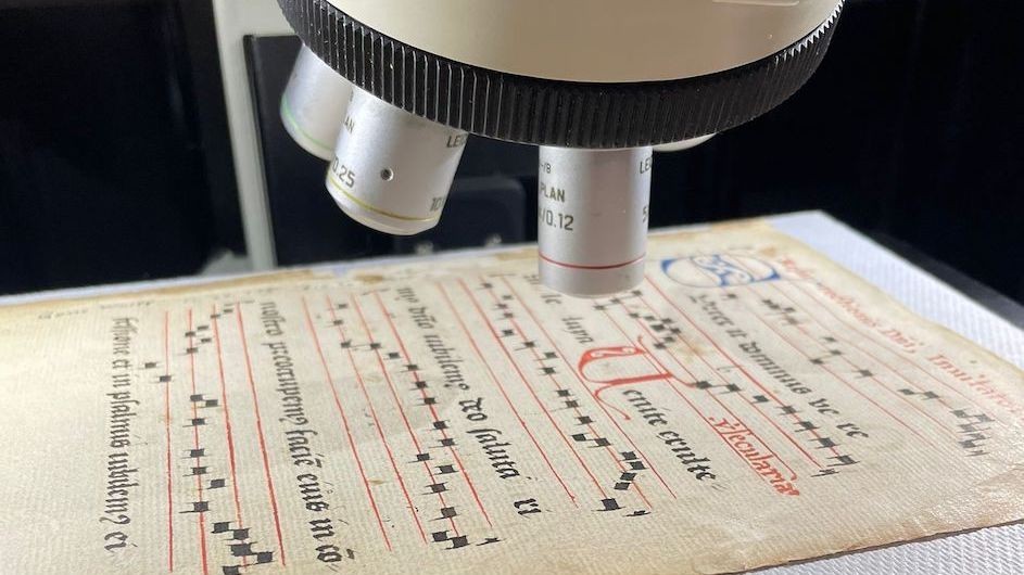 A booklet of 15th-century liturgical music, known as an antiphonary, being examined with the Columbia Nano Initiative's Raman spectrometer. The manuscript's official name is UTS MS 114.