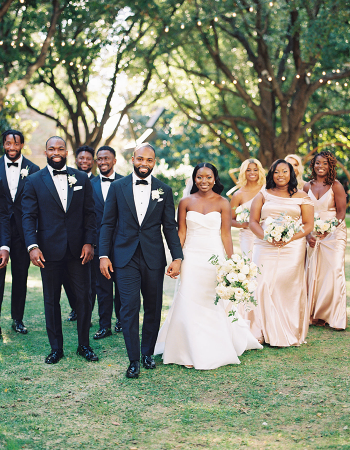 Anthony and Dmeca Maddox at their wedding with their Columbia groomsmen and bridesmaids