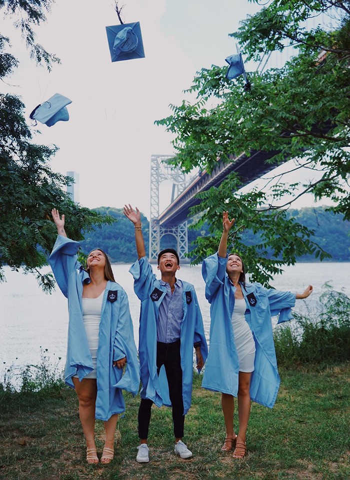 Jessie Mandel (NUR'22), Andy Tan (NUR'22), Megan Huott (NUR'22) photo courtesy of these graduates Grads throw their caps in front of the george washington bridge