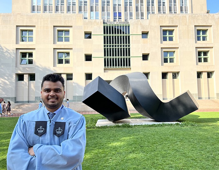 Aayush Kumar Verma (SEAS'23) with the curl sculpture