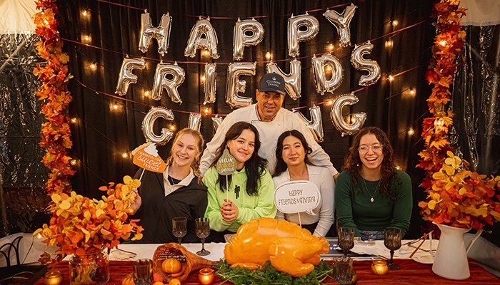 Photo by Brandon Vallejo/Columbia Dining. Friendsgiving Columbia Dining pose at photo booth