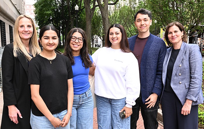 Melanie Bernitz, interim executive vice president for University Life and senior vice president for Columbia Health, and Acting President Claire Shipman pose with students on College Walk. Photo by Eileen Barroso. Melanie Bernitz and Acting President Claire Shipman pose with students.