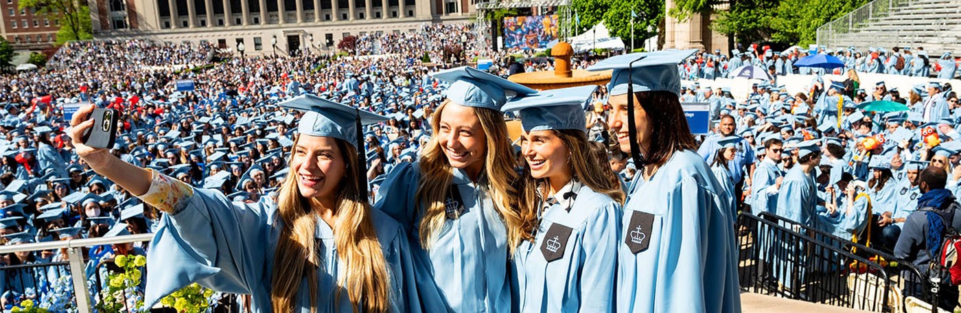 Columbia grads take selfies at Commencement.
