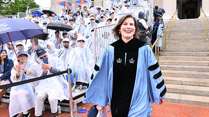 Acting President Claire Shipman enters the Commencement festivities with a smile before delivering the 271st Commencement Address. Photo by Eileen Barroso. Claire Shipman in regalia enters Commencement with a smile.
