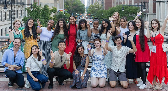A group of Columbia students stands on the bridge over Amsterdam. 