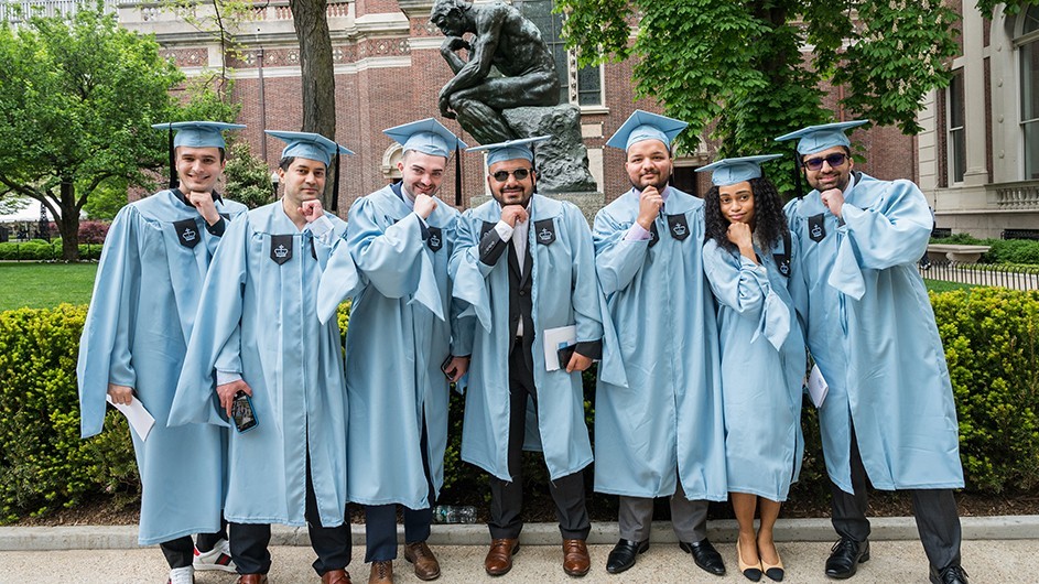 Grads pose in front of "le penseur"