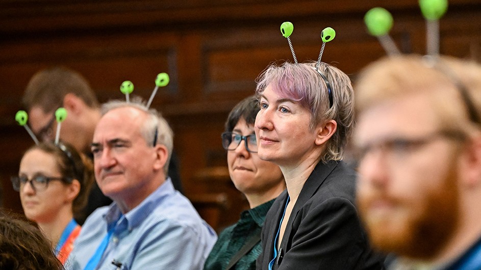 Faculty wear alien headbands