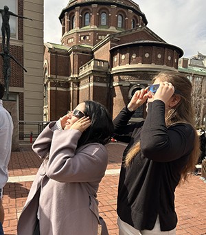 Sara Gomez Horta and her wife, Olivia, watch a solar eclipse. Columbia University student Sara Gomez Horta and wife watch the solar eclipse.