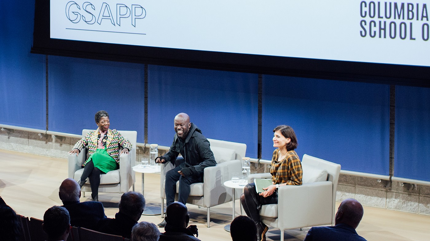 From left to right: Thelma Golden, director and chief curator of the Studio Museum in Harlem, architect David Adjaye and Amale Andraos, dean of the Graduate School of Architecture, Planning and Preservation. Three people sitting in chairs on a stage.