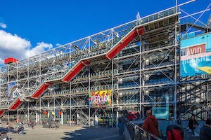 Large building with red escalator outside