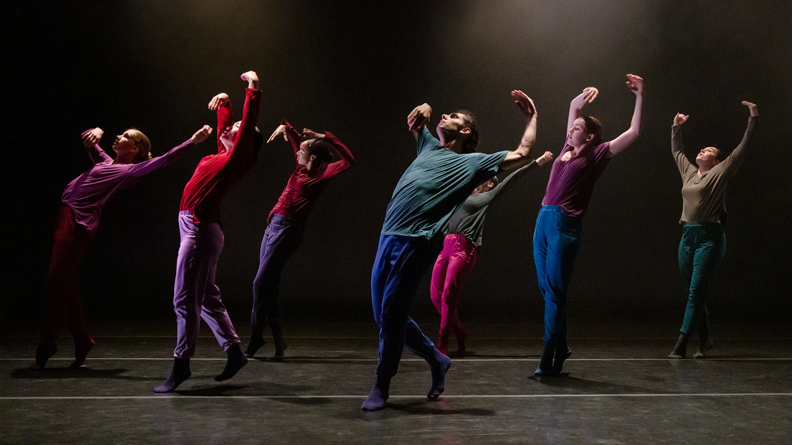 Barnard/Columbia Dances A group of dancers in multicolored clothing.