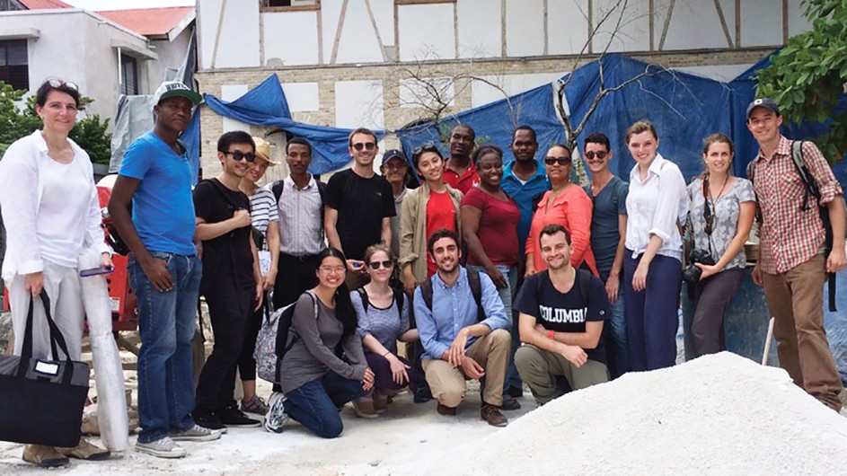 Students from the School of Architecture, Planning and Preservation in Haiti. A group of men and women, some kneeling in front, others standing in back.