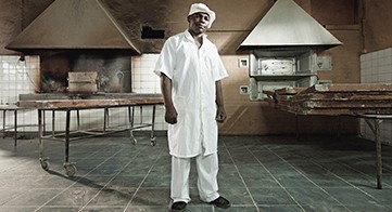 Jorge Macate, Padeiro (Jorge Macate, Baker), 2011, by Filipe Branquinho A photo of a man named Jorge Macate in a bakery by Filipe Branquinho