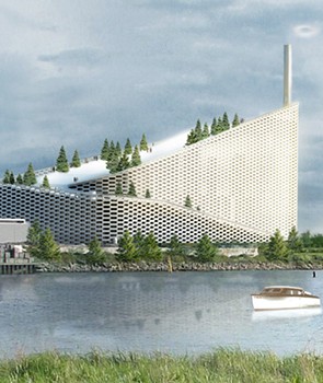 Copenhill, a power plant topped by a ski slope, in Copenhagen, designed by Bjarke Ingels. A silver curving building behind a body of water.