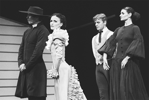 Appalachian Spring with Rudolf Nureyev (Preacher), Terese Capucilli (Bride), Mikhail Baryshnikov (Husbandman) and Maxine Sherman (Pioneer Woman), October 6, 1987. (C)Robert R. McElroy | Associated Press. Four people standing in a black and white photo