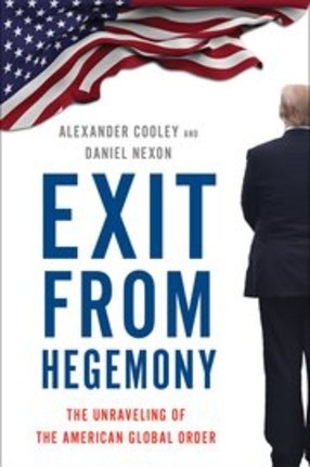 A book cover showing a man wearing a suit standing in front of an American flag
