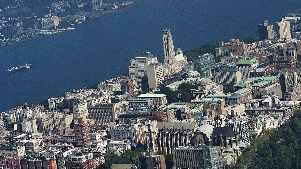 An aerial view of Morningside Heights, including Columbia's campus and the Hudson River