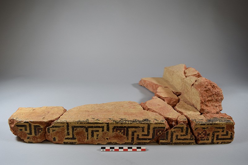 Part of the terracotta roofing system of a small square structure with painted decoration circa 4th century BCE. Image Courtesy of © Onchestos Excavation Project Piece of terracotta roof