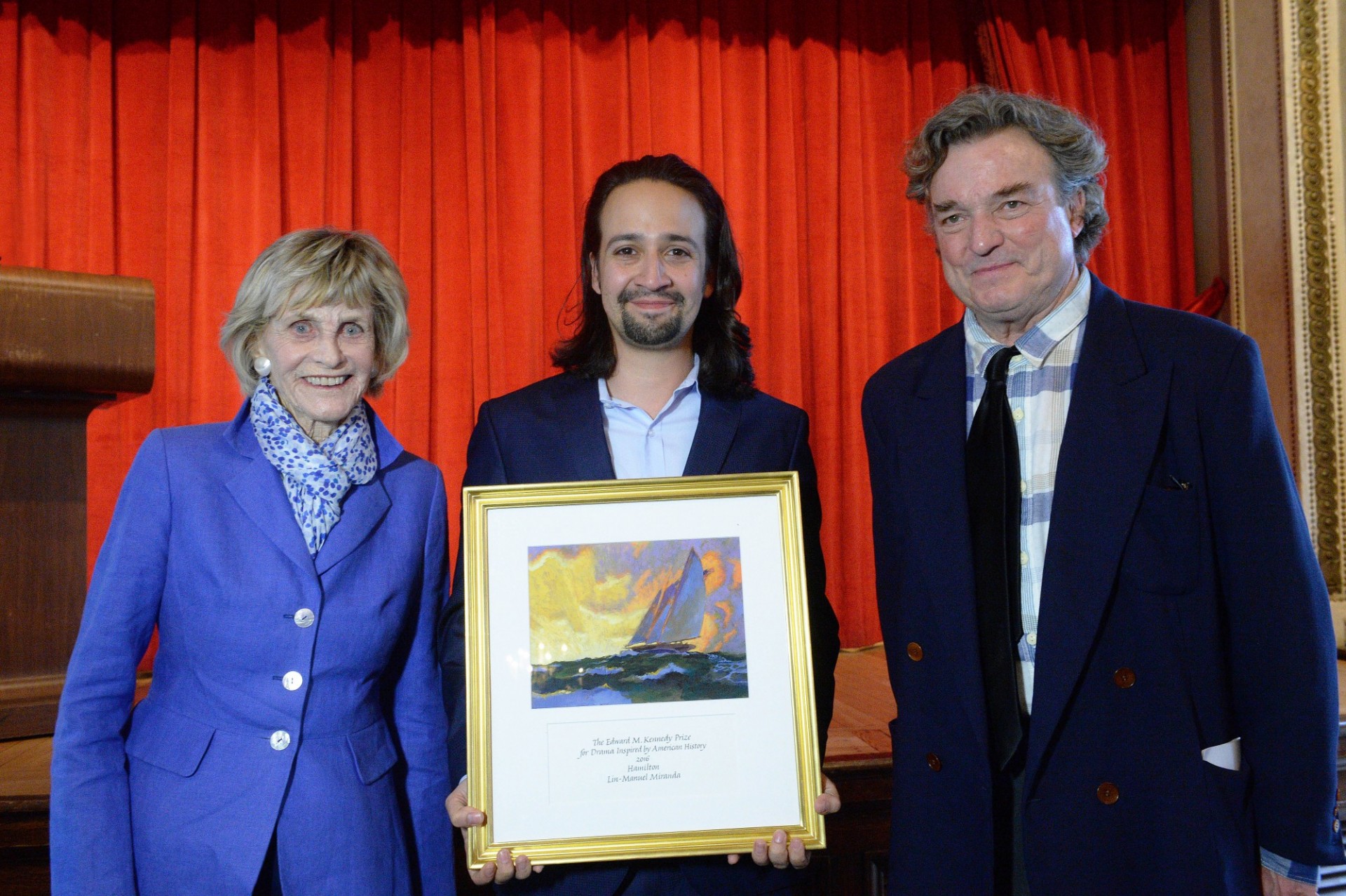 Miranda holds the Edward M. Kennedy Prize for Drama Inspired by American History awarded for his broadway play, Hamilton. Photo by Eileen Barroso Lin-Manuel Miranda holding framed art