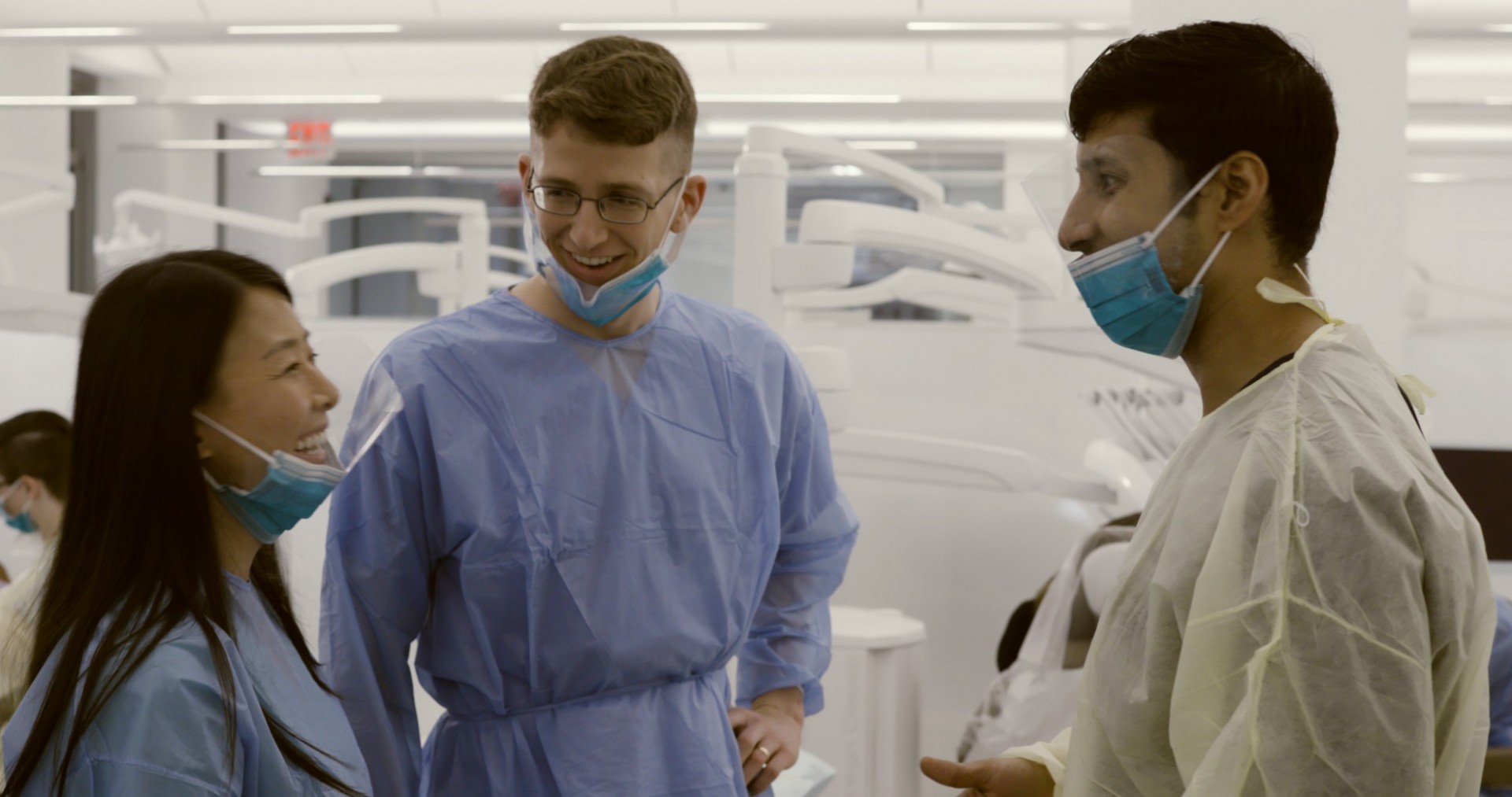 Three young dentists standing in a group