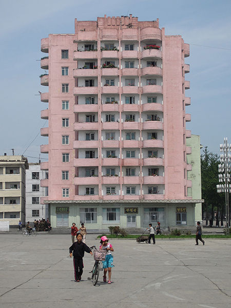 Photo Courtesy of Charles Armstrong Pink residential building