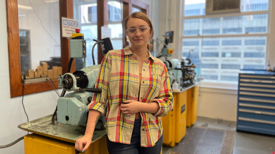 Staff Engineer Clara Wilson is reinventing the Columbia Physics Design Lab from a machine shop to a makerspace for users to imagine the future of physics. Clara Wilson standing in front of Columbia Blue lathe machines