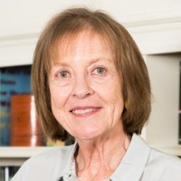 Frances FitzGerald: A woman with short brown hair smiling. 