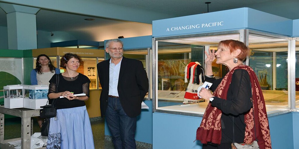 From left, Assistant Curator Jenny Newell and SVP of Exhibition David Harvey watch curator Laurel Kendall (GSAS'76,'77,'79) introduce the Columbia showcase.