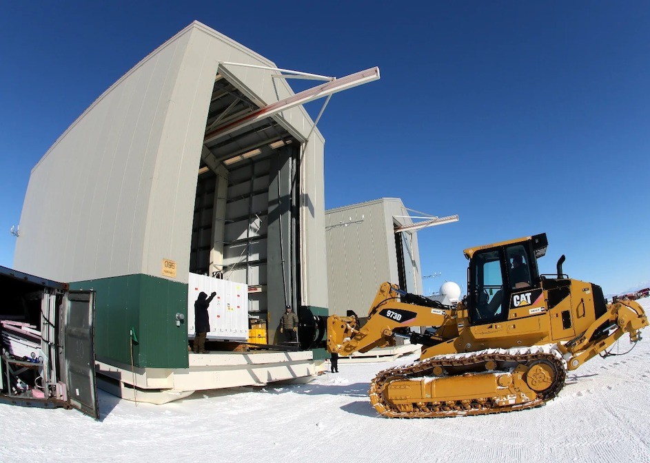 A tractor loading equipment for the GAPS project into a hangar near the McMurdo Station in Antarctica. A tractor loading equipment for the GAPS project into a hangar near the McMurdo Station in Antarctica.