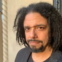 Frank Andre Guridy: A man with beard and dreadlock looking at the camera