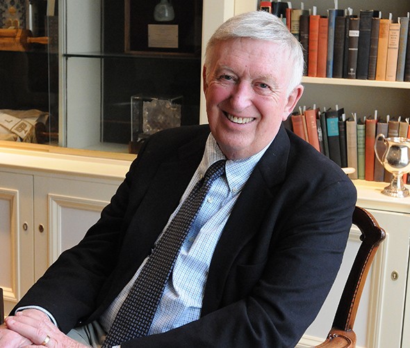 A man sitting and smiling