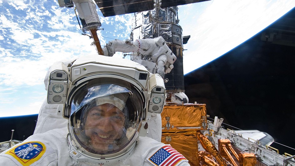 The lunar landing 50 years ago inspired Columbia professor Mike Massimino to become an astronaut. Photo: Courtesy of NASA Man in white space suit and helmet