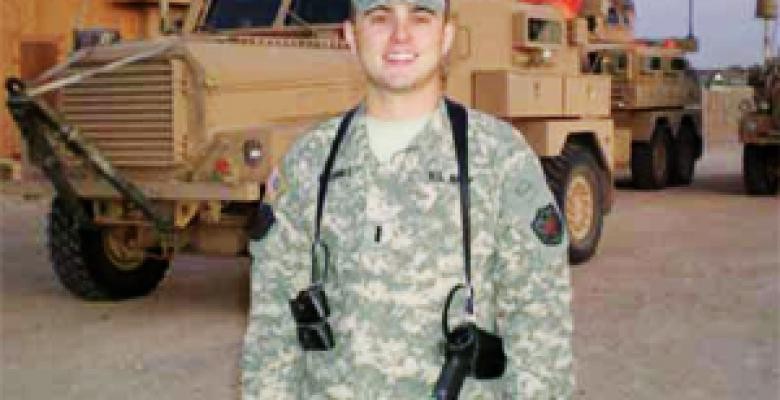 Mulhall in front of a Mine-Resistant Ambush Protected vehicle during a stop at a Marine Corps base in Al Anbar Province, Iraq Brian Mulhall