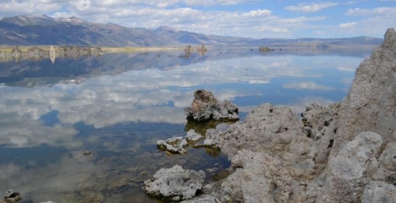 Runoff from snow and rain in the Sierras feeds Mono Lake. Photo: D. Funkhouser A lake with clouds reflected in its surface