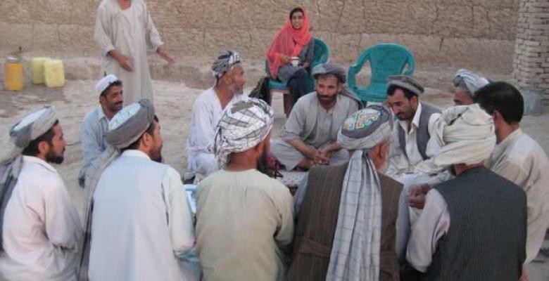 Group of men sitting in a circle