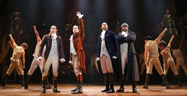 Actors from Hamilton on stage