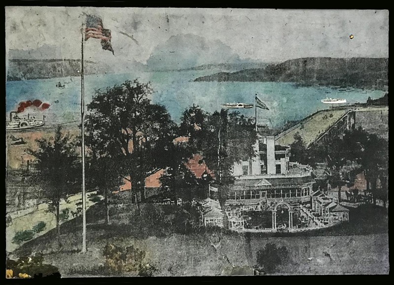 A mixed media landscape of an ornate building and grounds, with an American flag on a flagpole in the foreground and a river in the background