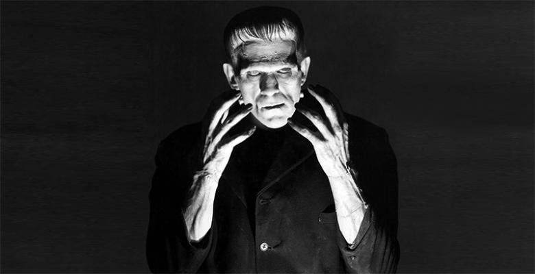 Boris Karloff as Frankenstein's monster in the 1931 film Frankenstein, with prosthetic hands featuring elongated fingers