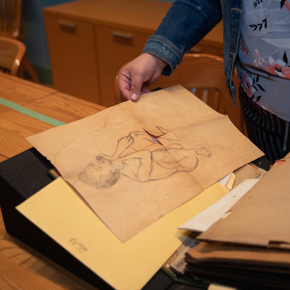 “One of my favorite pieces in the Gumby collection was a drawing of a nude man that I found tucked in the back of Gumby’s scrapbook. This drawing, which resembles the Le Penseur statue outside of Philosophy Hall, demonstrates the ways in which Gumby reimagined Columbia's campus as a black space,” Anderson said. A photo of an old pencil drawing of a man who looks like "The Thinker"