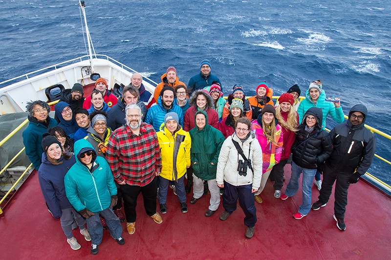 An aerial photo of the Joides Resolution Science crew at the bow of the ship.