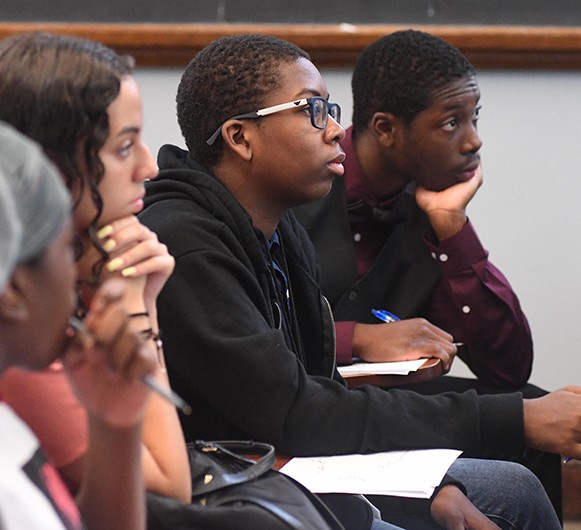 Students listening to a teacher